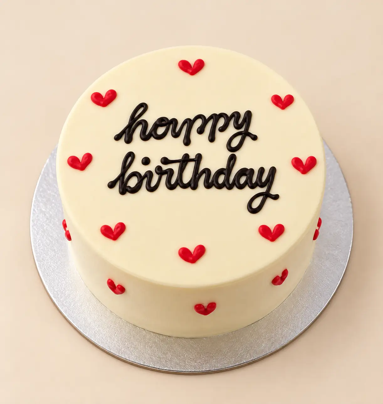 happy_birthday_bento cake Happy Birthday Bento Cake with ivory frosting, black lettering, and red heart decorations